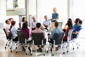 Businesswoman Addressing Multi-Cultural Office Staff Meeting